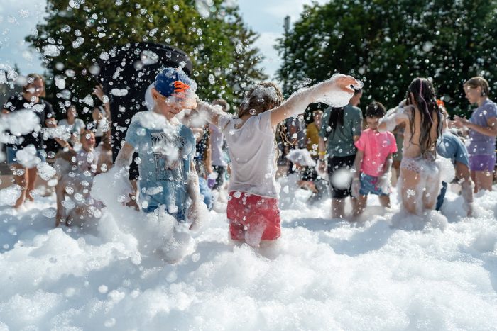 Kids playing in foam.