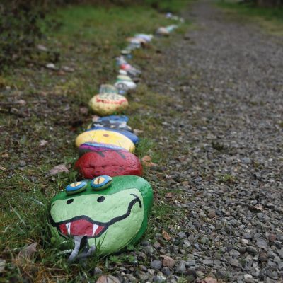 Colorful painted rock garden snake.