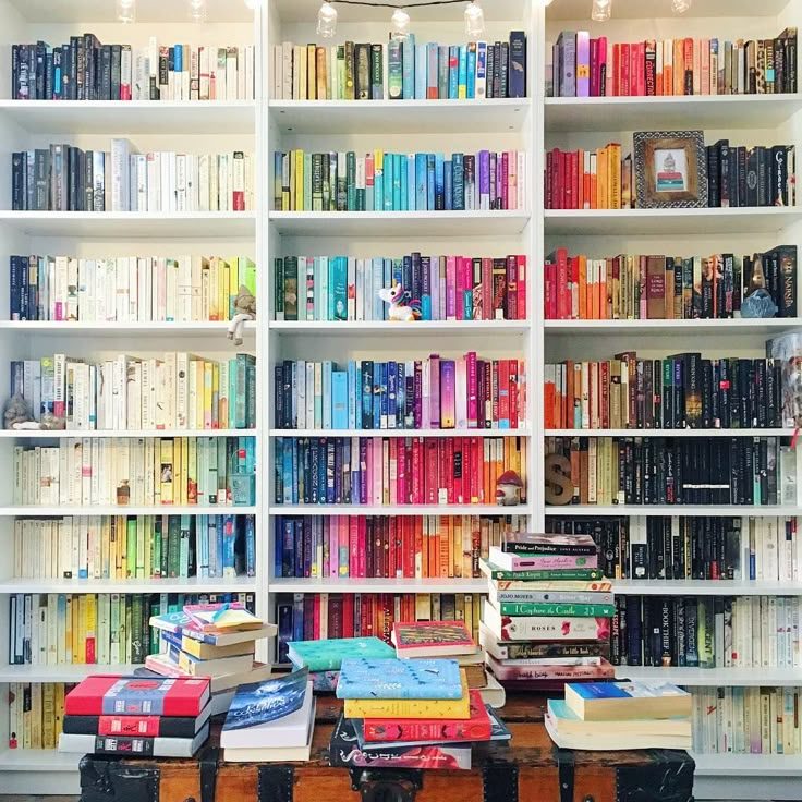 June_ColorYourWorldScavengerHunt (PopSugar) Colorful books on a white book shelf.